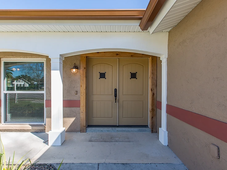 Finished home exterior after whole-home renovation by Home Res-Q