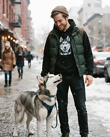Pet owner wearing personalised pet portrait apparel with their pet