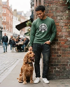 Pet owner wearing personalised pet portrait apparel with their pet