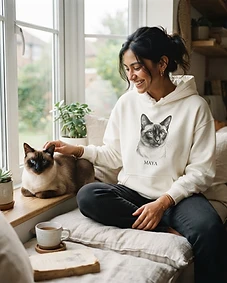 Pet owner wearing personalised pet portrait apparel with their pet