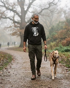 Pet owner wearing personalised pet portrait apparel with their pet