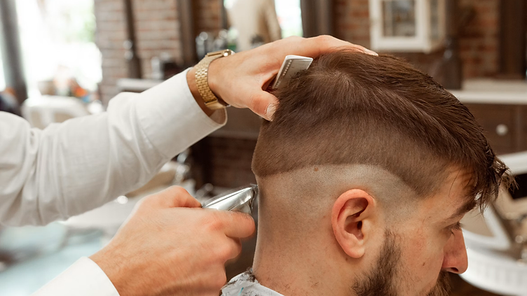 Barbershop checking new job requests on his phone