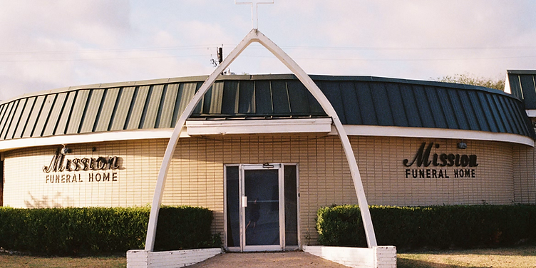 Funeral home building with landscaped entrance