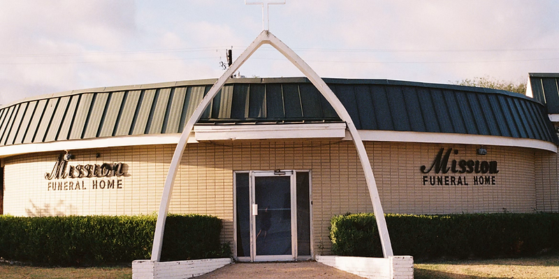 Funeral home building with landscaped entrance
