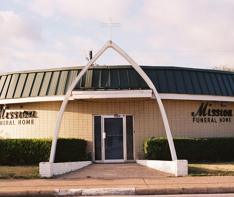 Funeral home building with landscaped entrance
