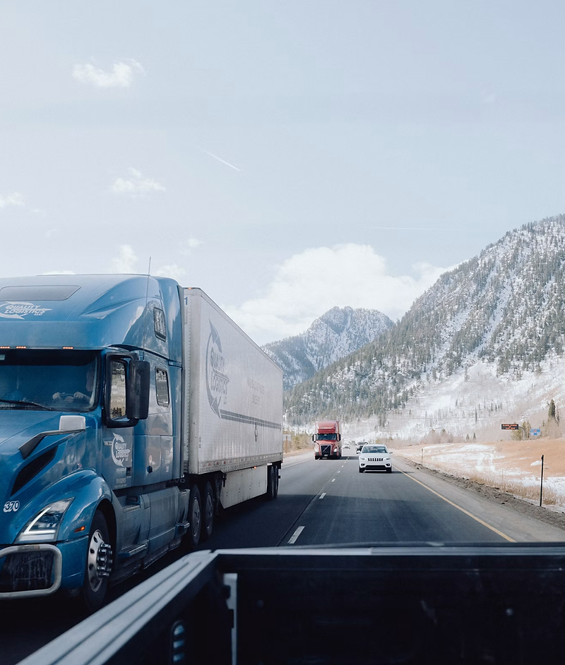 Trucking company website design: semi truck on the highway