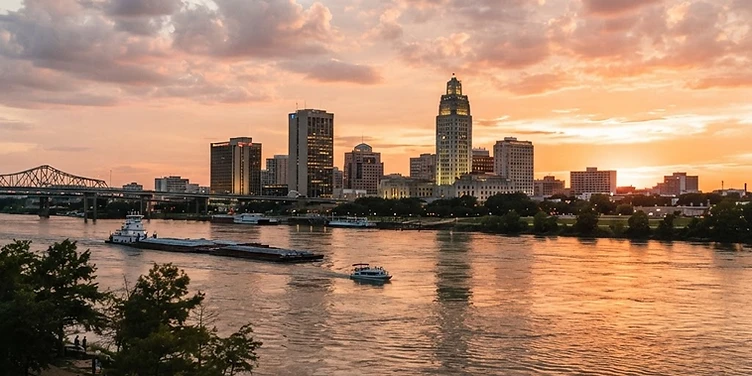 Baton Rouge skyline along the Mississippi River at sunset