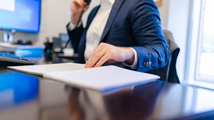 Insurance Agency checking new job requests on his phone