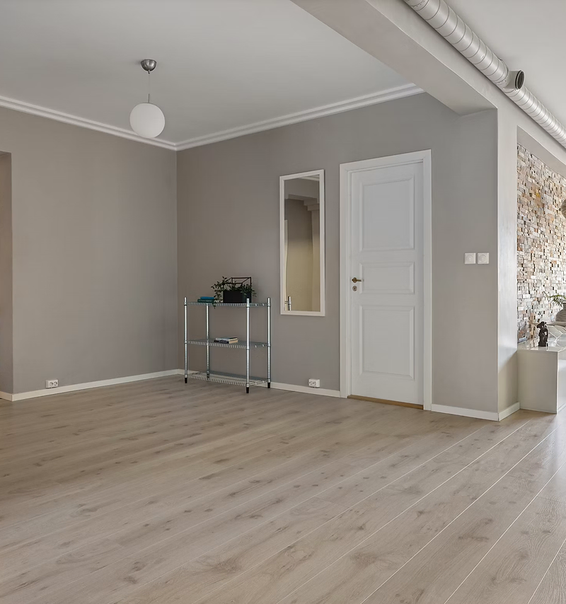 Flooring company website design: open living space with light oak plank flooring
