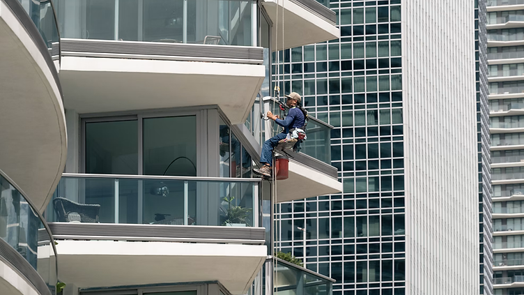 Window Cleaning checking new job requests on his phone