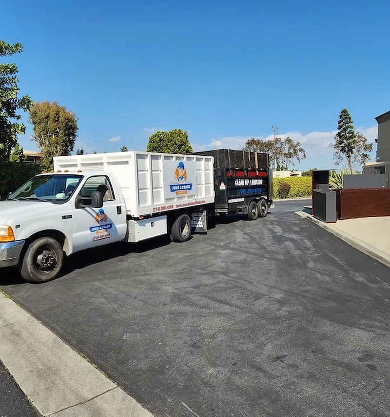Junk removal website design: crew loading an old couch into a truck