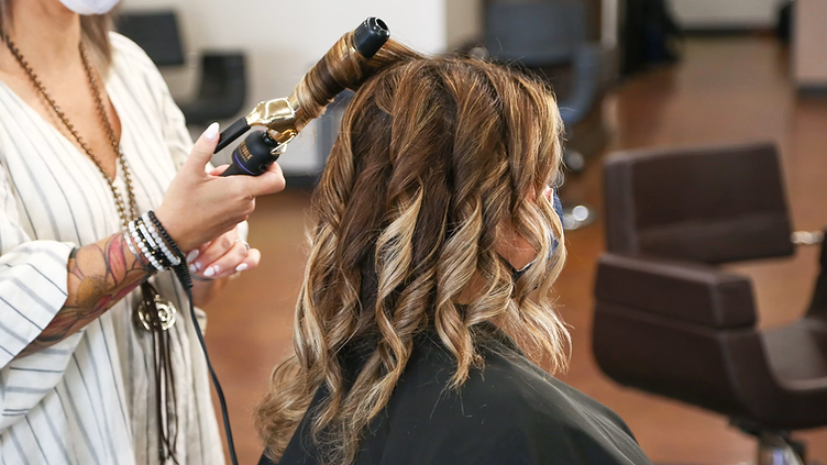 Hair Salon checking new job requests on his phone