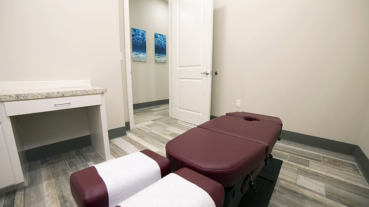 Chiropractor checking new job requests on his phone