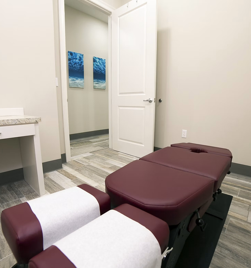 Chiropractor website design: chiropractor adjusting a patient