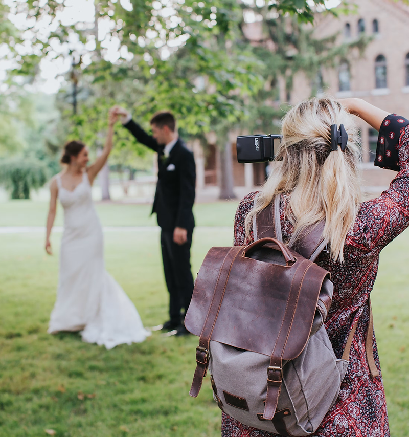 Photographer website design: photographer shooting a portrait session at golden hour