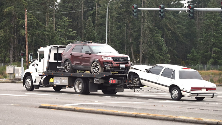 Towing checking new job requests on his phone