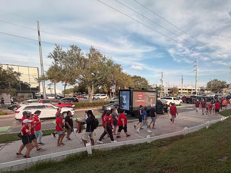BeSeen mobile LED billboard truck displaying a campaign to a crowd of fans on game day in Tampa
