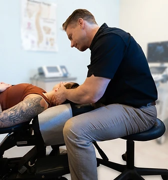 Dr. Roberts, DC performing a spinal adjustment