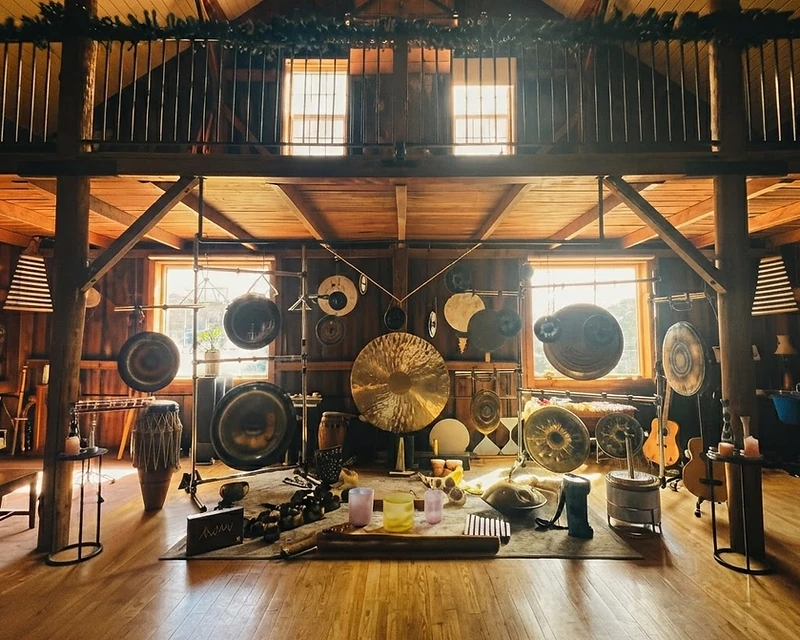 A bronze gong in low, warm light