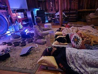 Participants resting during a sound bath inside the barn