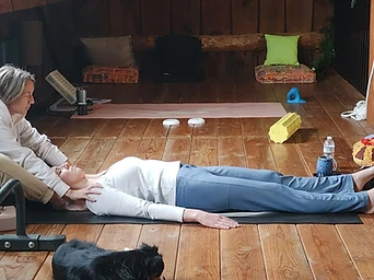 A practitioner guiding a participant through a sound session