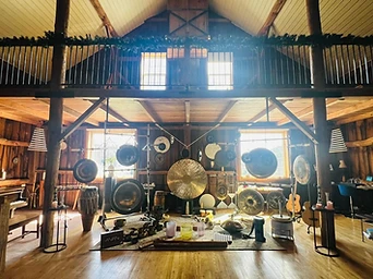 The interior of The Organ Barn filled with gongs and instruments
