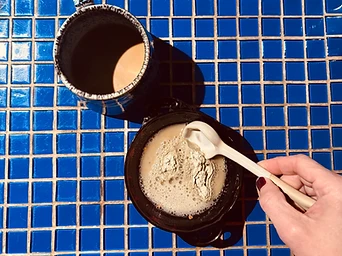 Mixing a bowl on a blue mosaic tile table