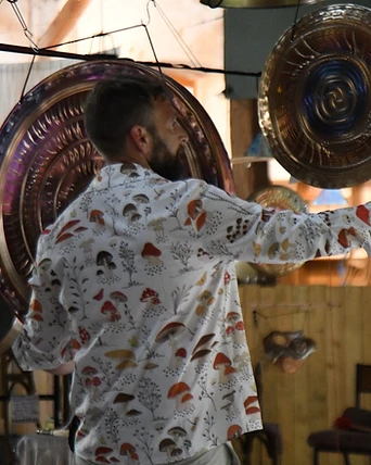 A practitioner striking a hanging gong