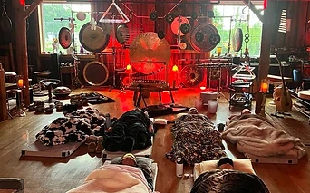 A sound bath resting in deep red light