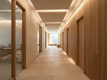 A quiet modern clinic corridor in warm light
