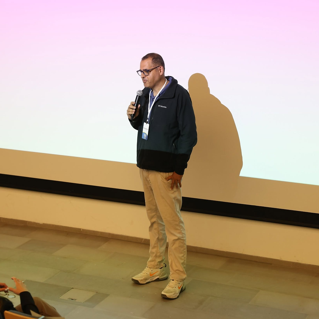 Dr. Amir Tal speaking to an audience