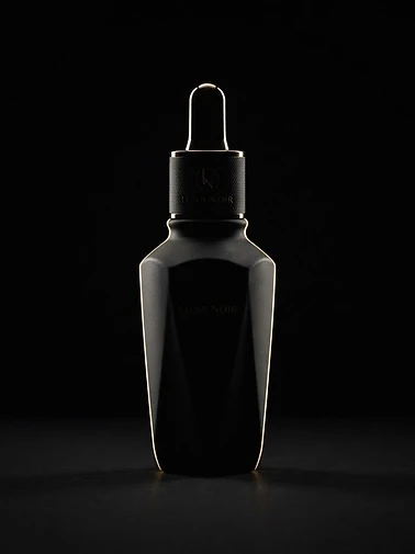 The matte black Black Label bottle traced by a beam of gold light