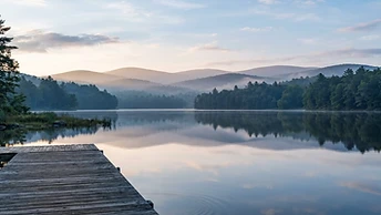 Misty morning over a lake in the Pocono Mountains of Pennsylvania