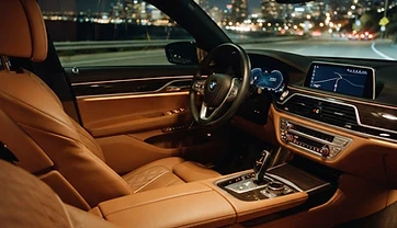 Luxury car interior at night with city lights