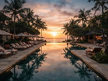 A serene resort-style pool at sunset