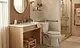 Comfort-height toilet with grab bar and seated-access vanity