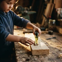 Student measuring and marking lumber