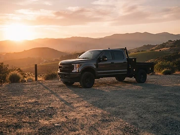 Work truck parked at golden hour