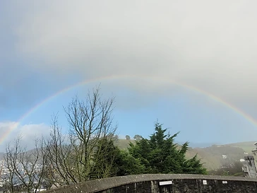 A rainbow over the boats and rooftops of Dartmouth
