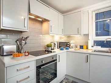 The fully fitted kitchen, with oven, hob and dishwasher