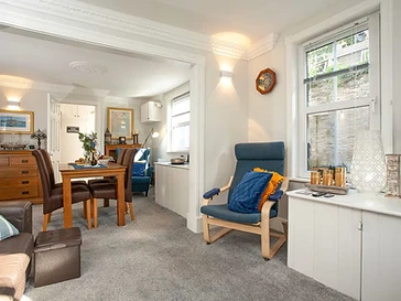 A reading chair by the window in the lounge