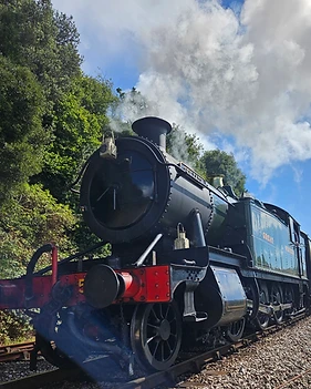 Steam train running along the River Dart at Kingswear