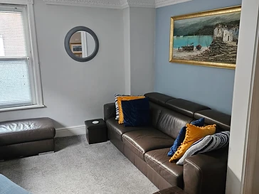 Leather sofas and nautical cushions in the lounge