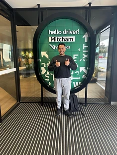 A happy Green Signals Driving School student holding their VicRoads congratulations certificate after passing at Mitcham.