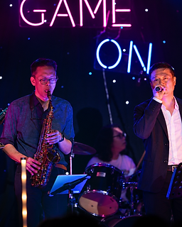 GAME ON guitarist, saxophonist and vocalist performing together