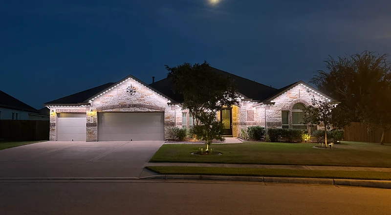Architectural detail of a luxury home with warm white lighting