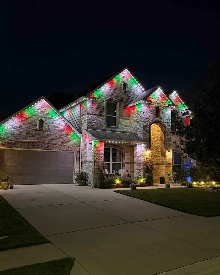 Upscale home with professional warm white Christmas lighting