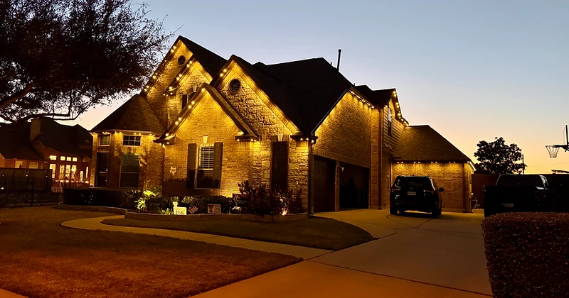 Luxury home at night with architectural lighting