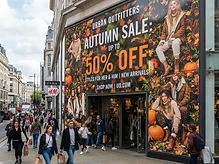 Retail store window fully wrapped with promotional vinyl graphics for a seasonal campaign