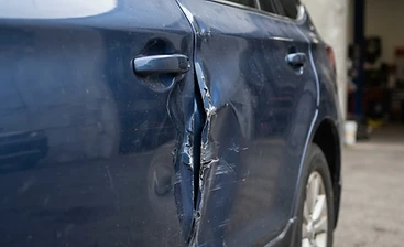 Dented Door before repair